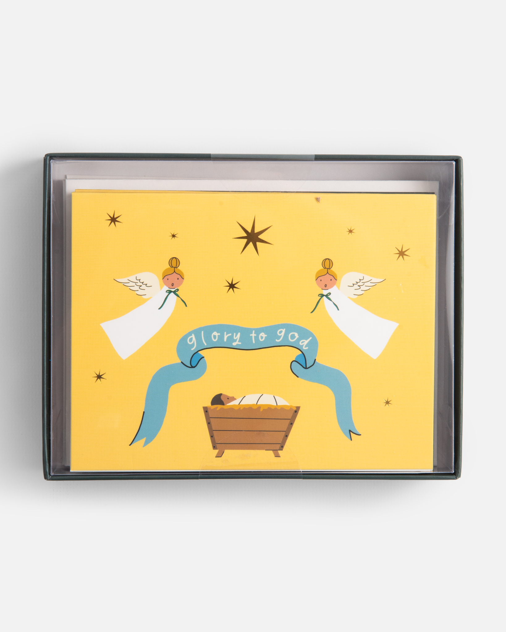 Christian Christmas card set with gold-foil Nativity illustrations featuring baby Jesus in the manger, angels, Holy Family, and starry sky. Includes 12 religious Christmas cards with envelopes in a keepsake box—perfect for faith-based holiday greetings and Christ-centered Christmas traditions.