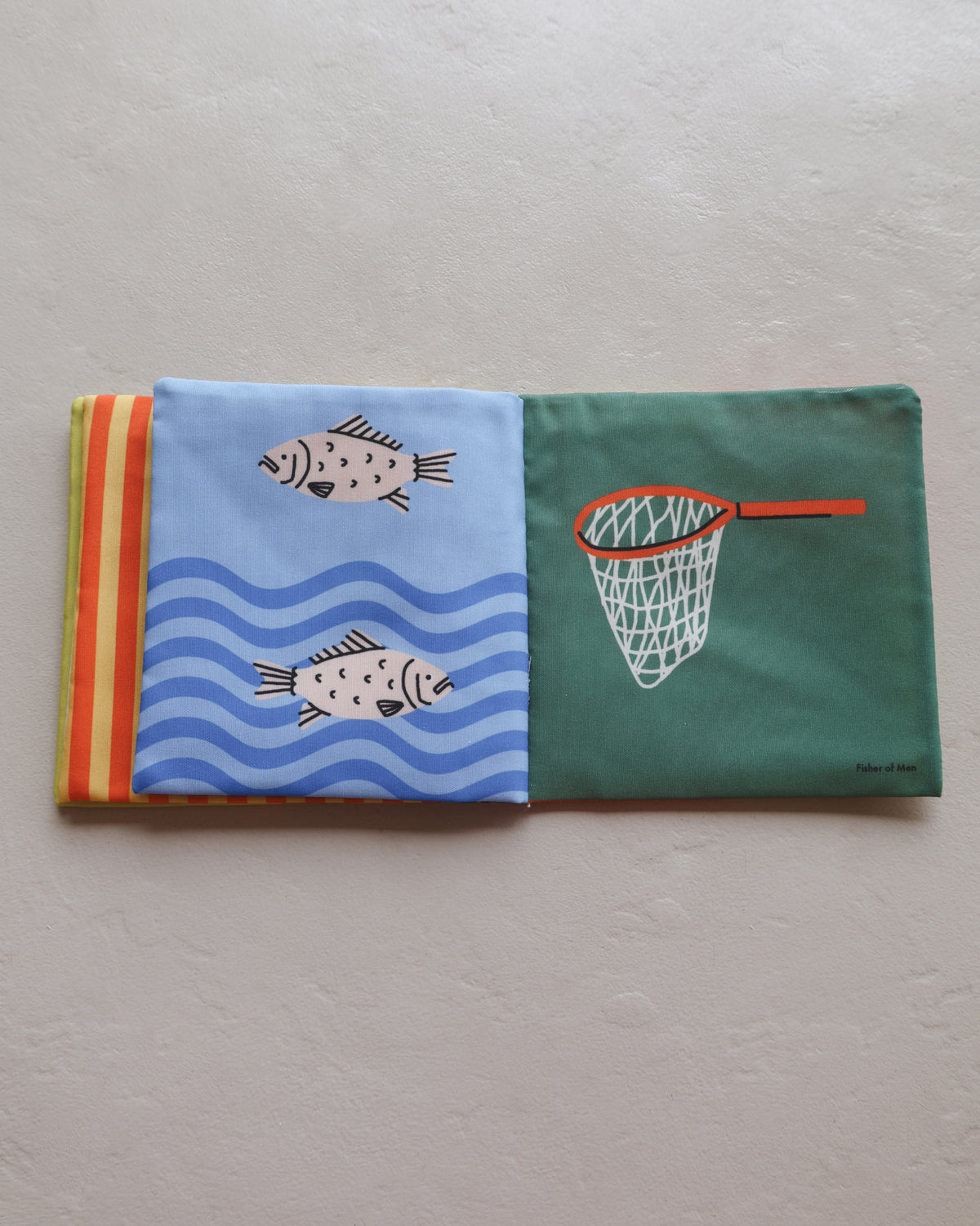 Fish and fishing net pages in Baby's First Book of Jesus crinkle book