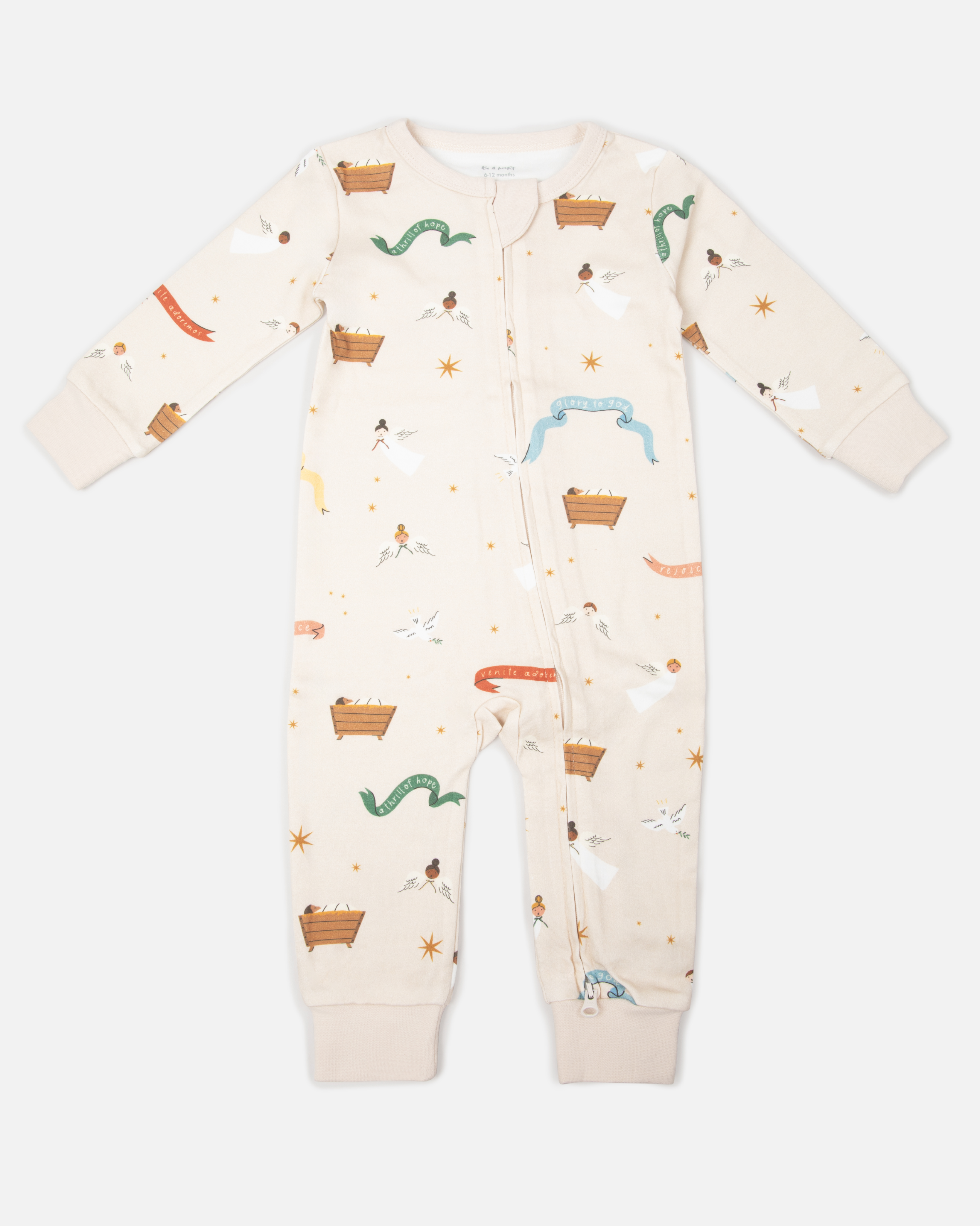Children’s Christmas pajamas—sleeper and long john styles—with illustrations of angels, baby Jesus in the manger, and doves.