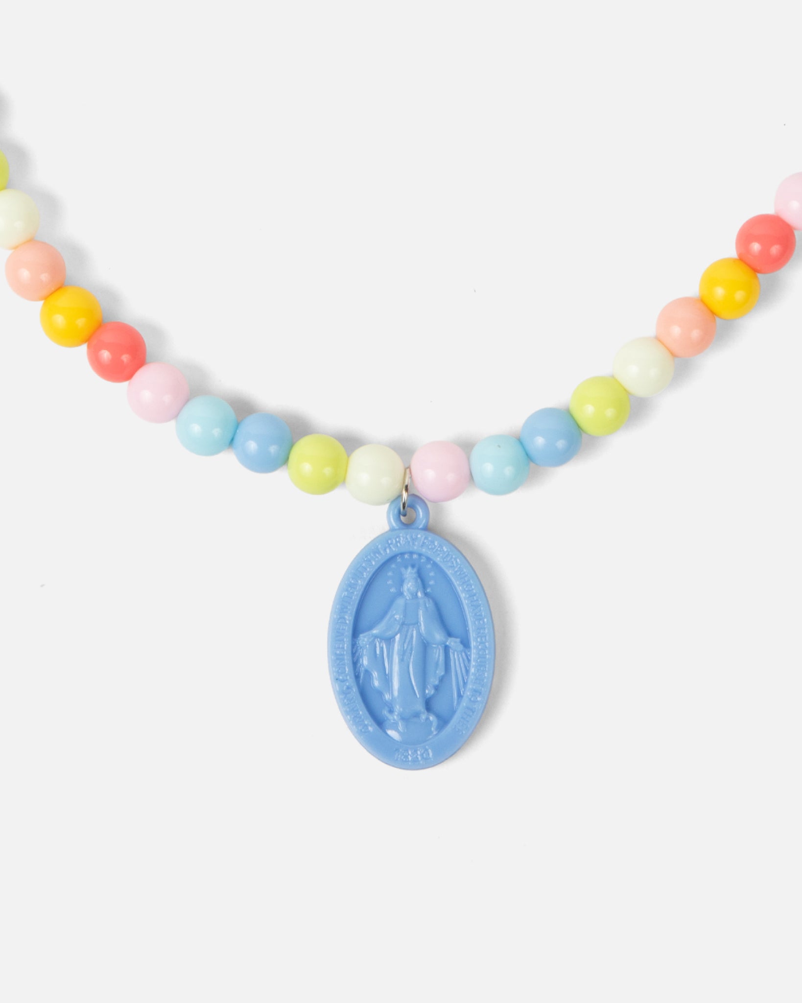 Children’s Miraculous Medal necklace with soft blue medal and colorful plastic beads on elastic strand. Christian kids’ jewelry for Marian devotion, First Communion, or faith-based gifts, reminding children of Mary’s protection and intercession.