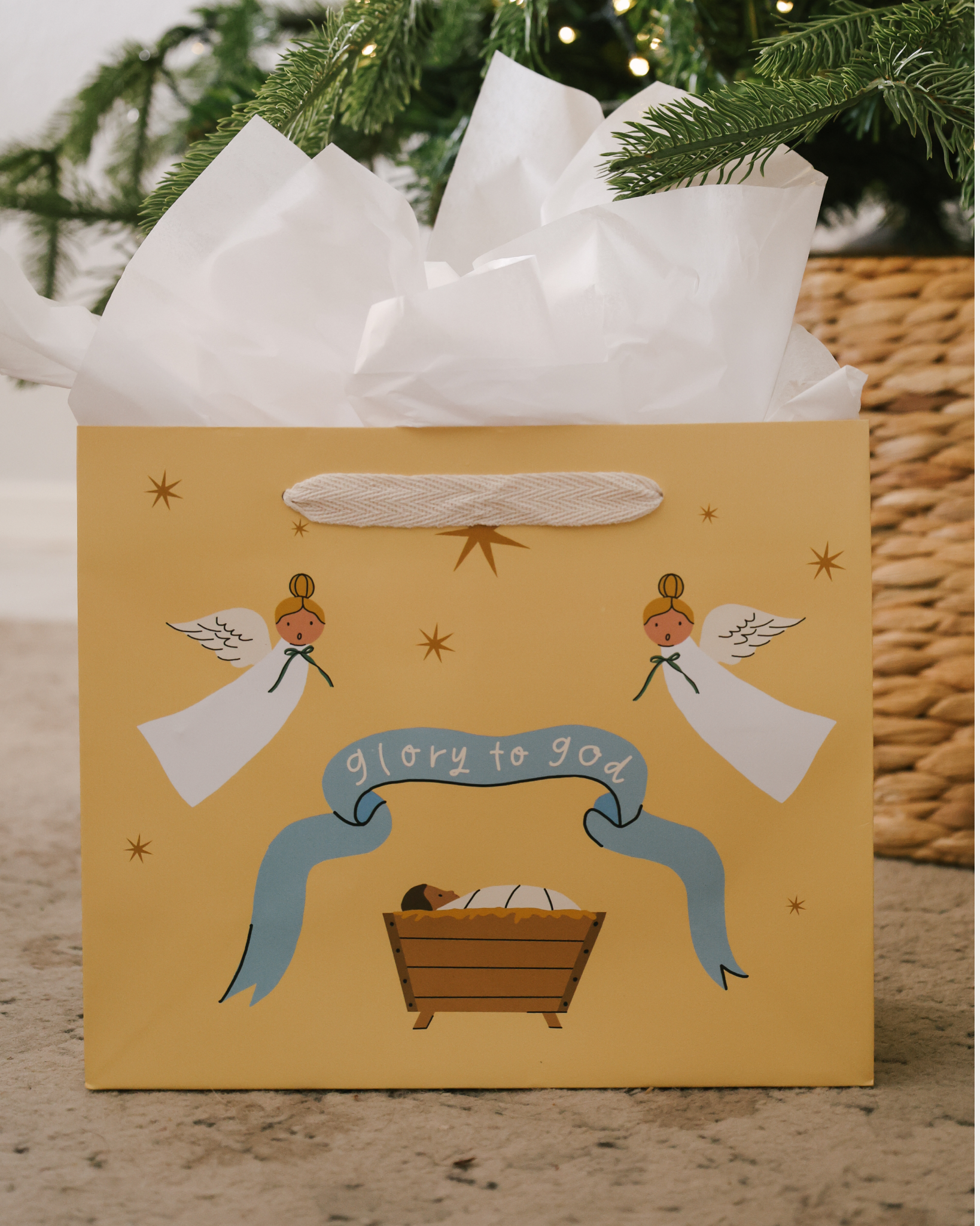 Glory to God Christmas gift bag set with baby Jesus in the manger, angels, and starry sky design. Includes 5 bags in 3 sizes with cotton ribbon handles and matching gift tags.