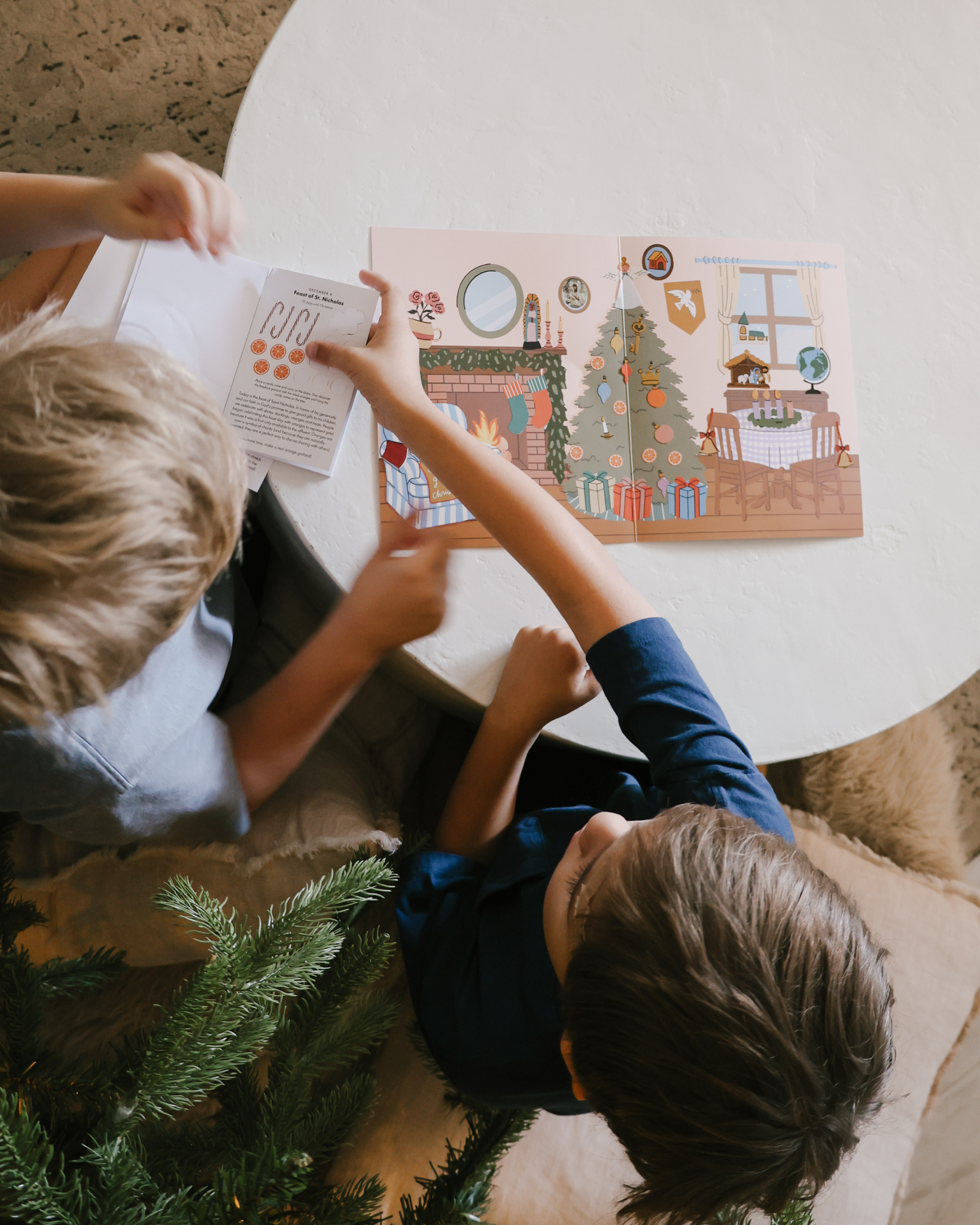 Liturgical Advent Calendar with illustrated scene and 26 sticker sheets, teaching children about Advent, feast days, and Christmas traditions. Suitable for ages 4+.