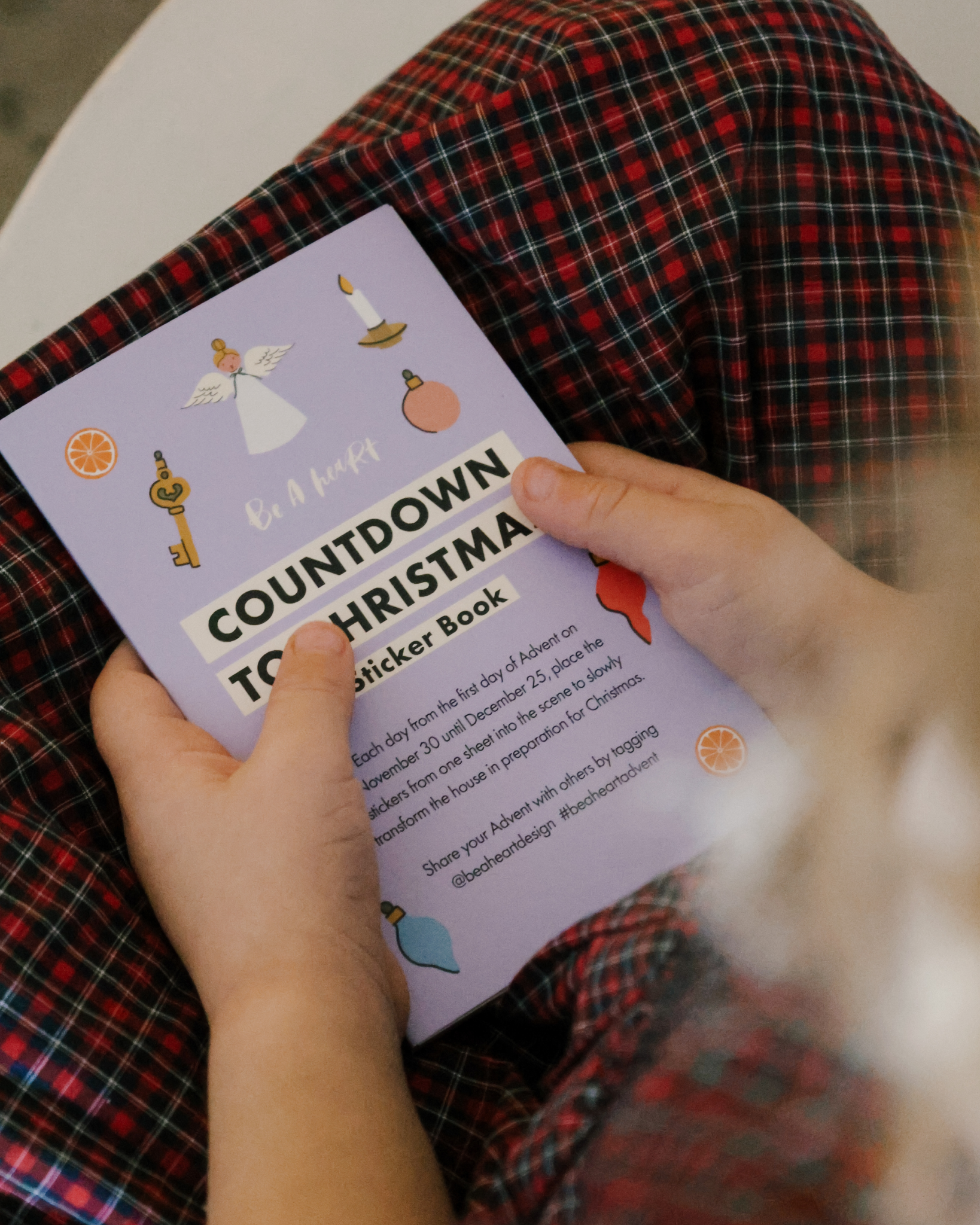 Liturgical Advent Calendar with illustrated scene and 26 sticker sheets, teaching children about Advent, feast days, and Christmas traditions. Suitable for ages 4+.