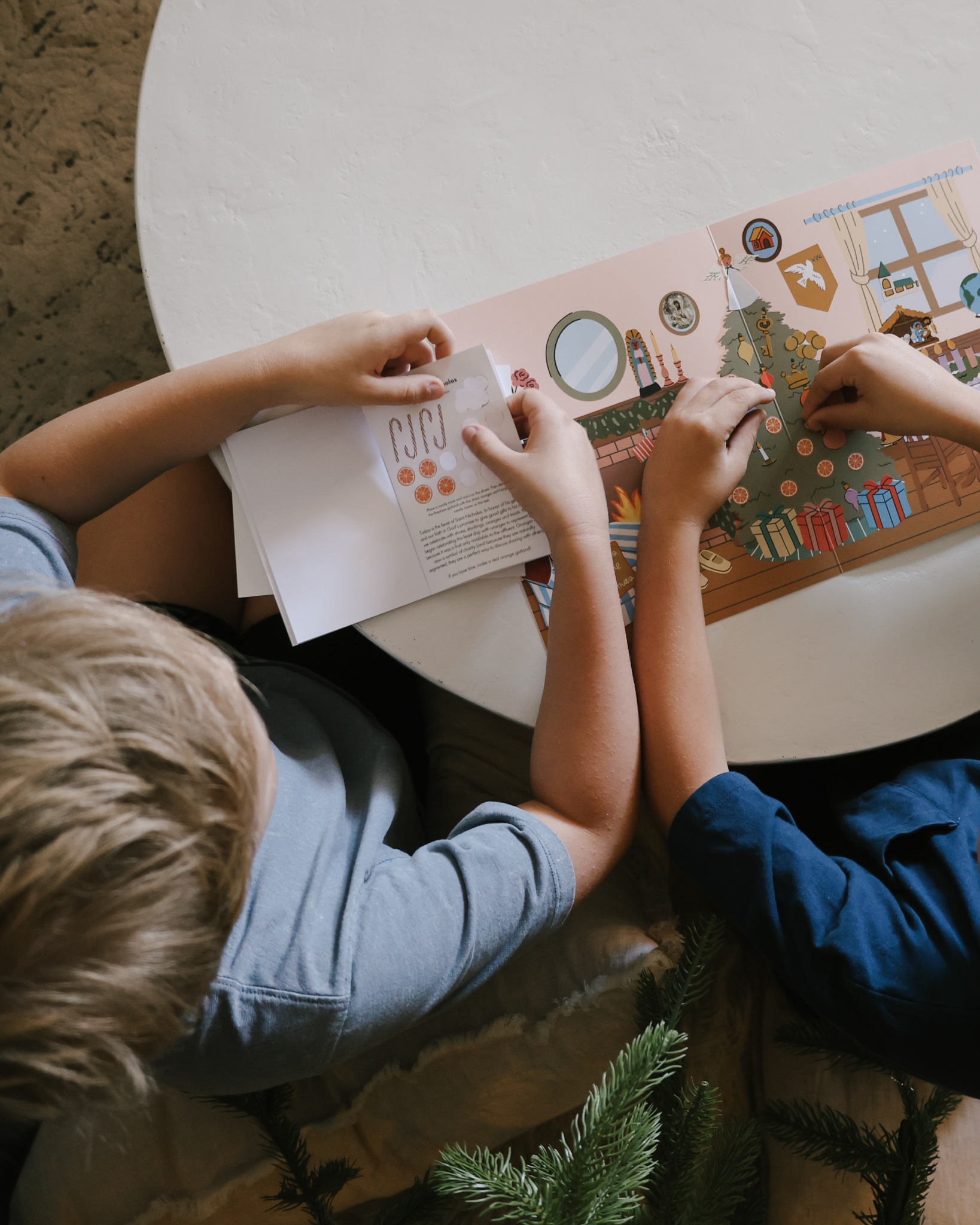 Liturgical Advent Calendar with illustrated scene and 26 sticker sheets, teaching children about Advent, feast days, and Christmas traditions. Suitable for ages 4+.