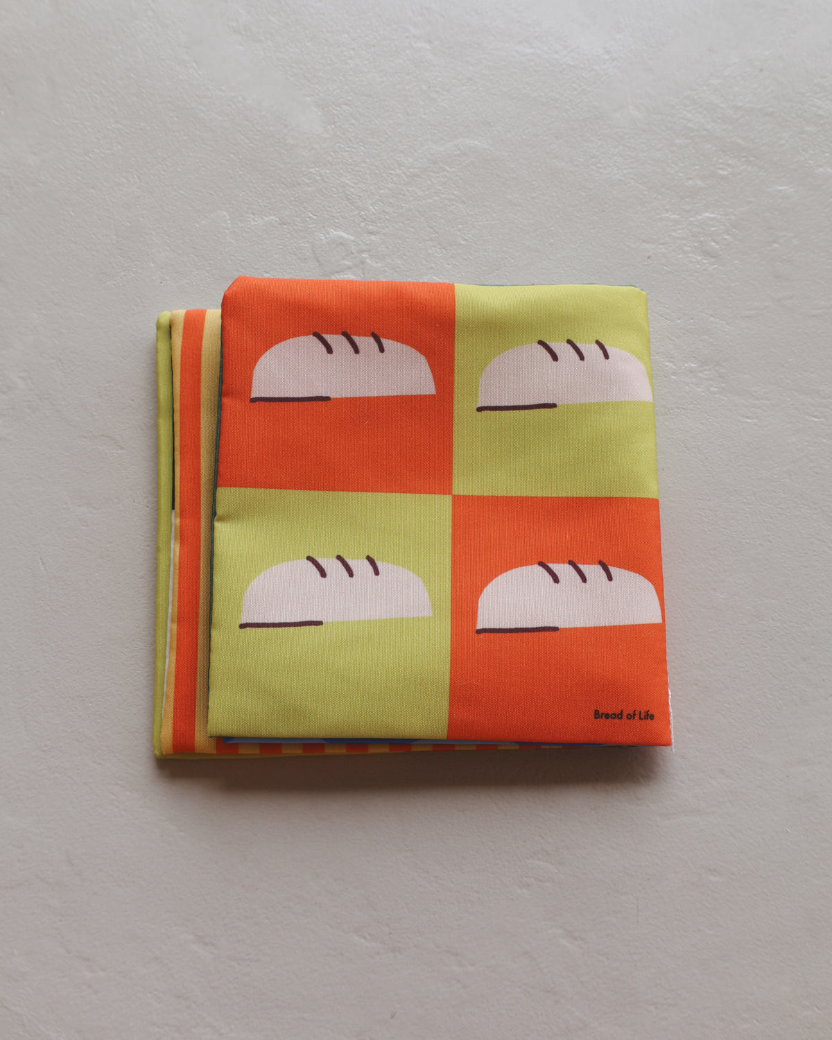 Bread loaves high contrast page in Baby's First Book of Jesus soft cloth book