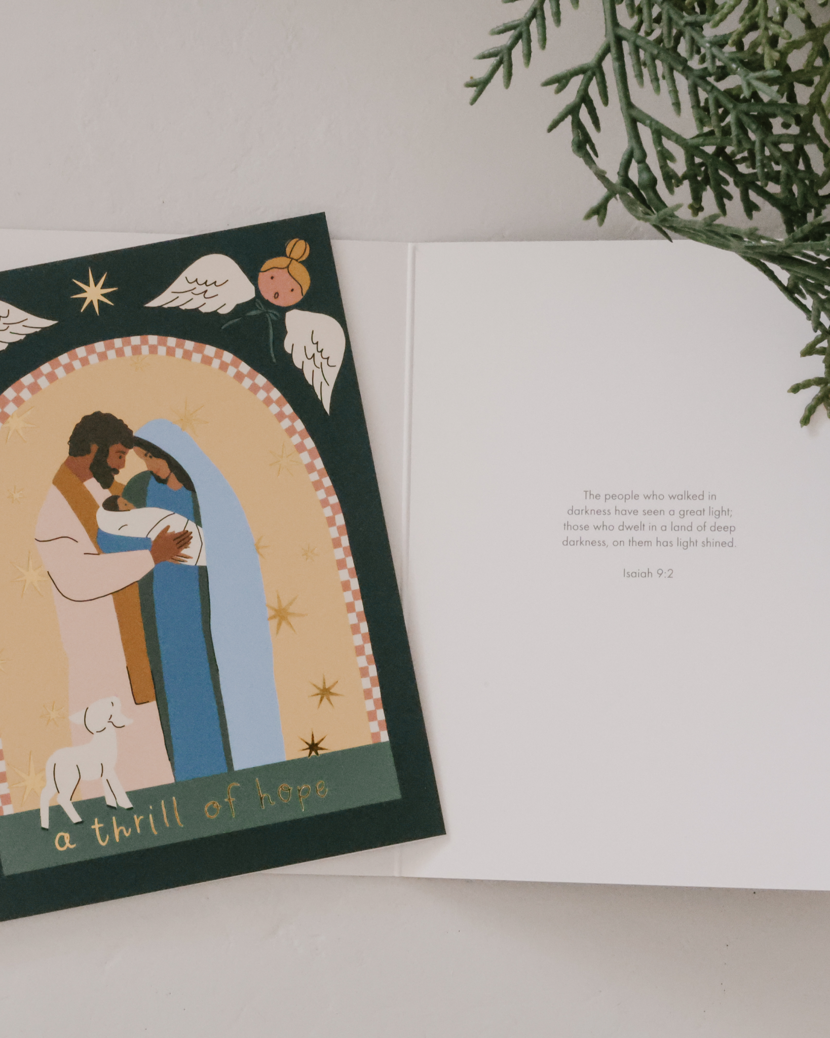 Christian Christmas card set with gold-foil Nativity illustrations featuring baby Jesus in the manger, angels, Holy Family, and starry sky. Includes 12 religious Christmas cards with envelopes in a keepsake box—perfect for faith-based holiday greetings and Christ-centered Christmas traditions.