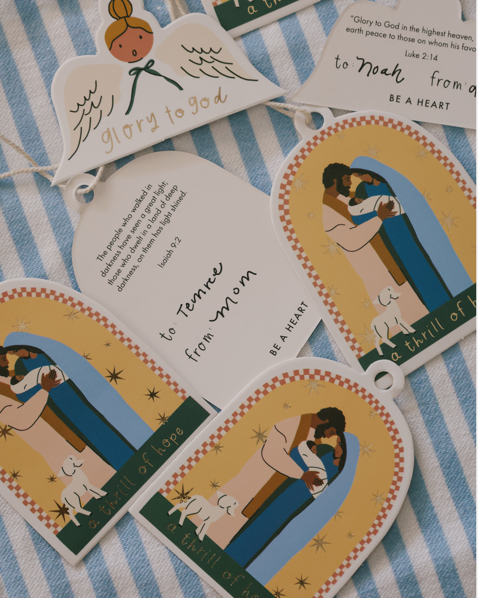 Christian Christmas gift tags featuring Nativity illustration of Mary, Joseph, and baby Jesus with ‘A Thrill of Hope’ message. Set of 8 die-cut tags with cotton string, perfect for faith-based holiday gift wrapping and Nativity-themed Christmas presents.