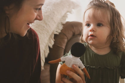 alt="Jesus Doll Gift Playing With Mom and Baby Girl"